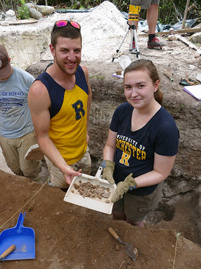 Students show bones, shell, and ceramics from the 17th century