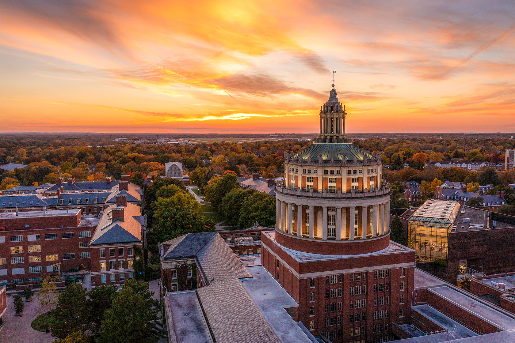 aerial photo of rush rhees and campus during a sun set