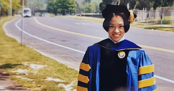 Joanne Y. Law at the University’s 1998 Commencement ceremony