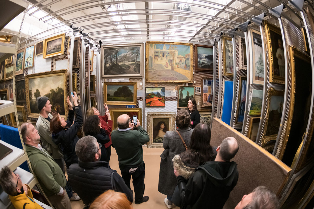 group viewing art in the MAG storage