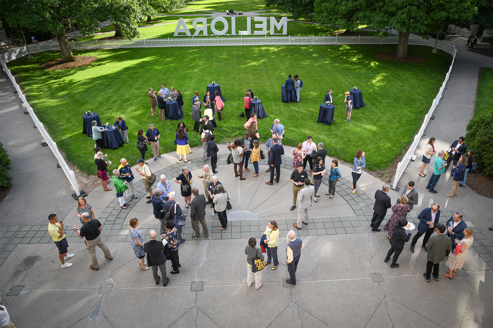 overhead image of a group of people assembling in quad.