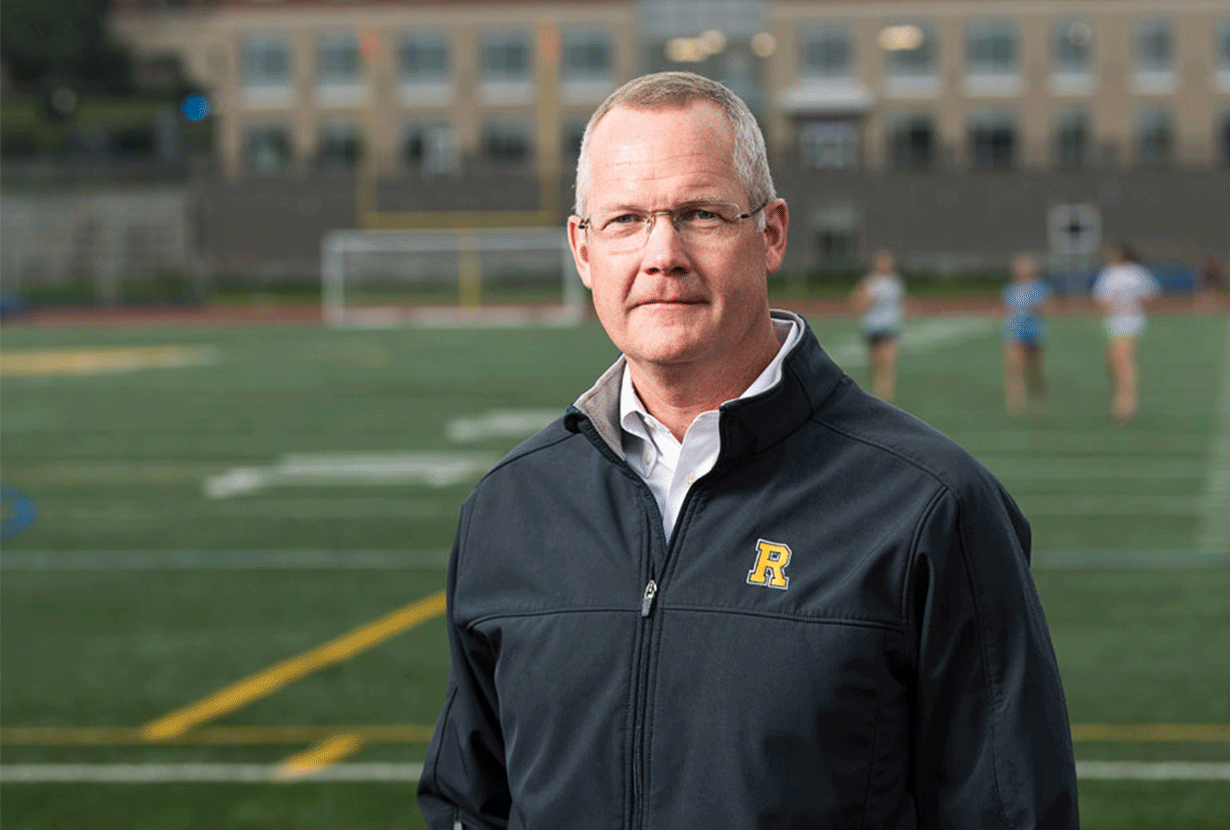 GEORGE VANDERZWAAG EXECUTIVE DIRECTOR OF ATHLETICS photo on an athletic field