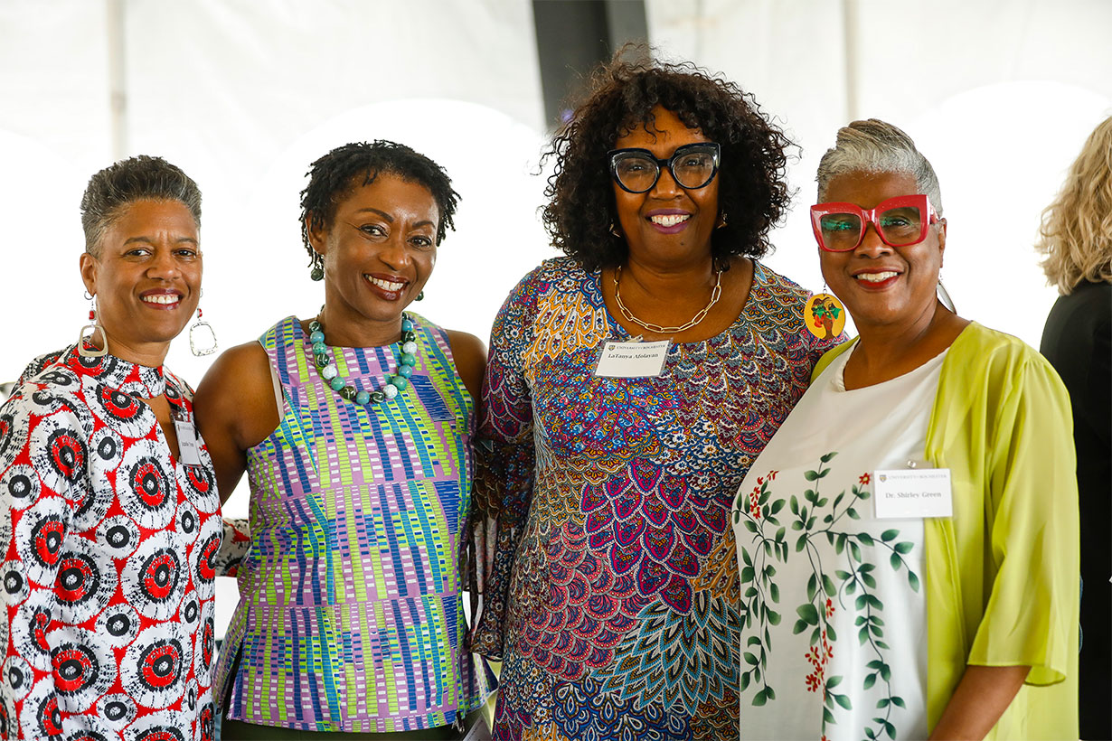 four women standing for photo
