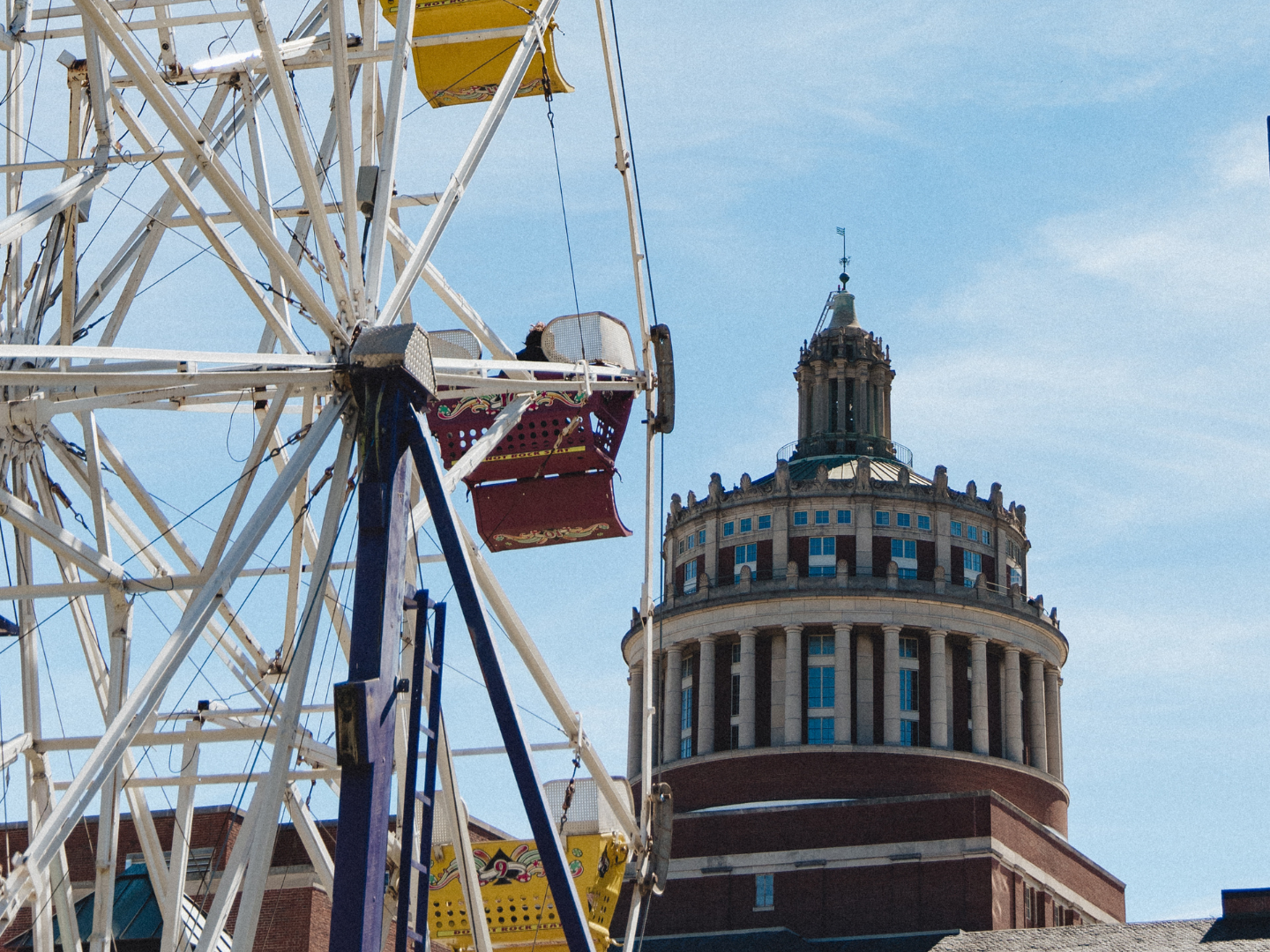 The Meliora Weekend ferris wheel with Rush Rhees library in the background