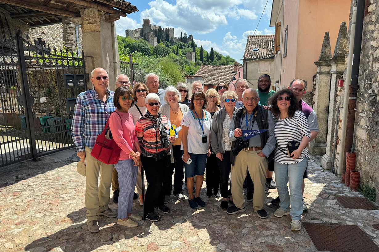 Group of Rochester alums posing for group photo during a trip abroad