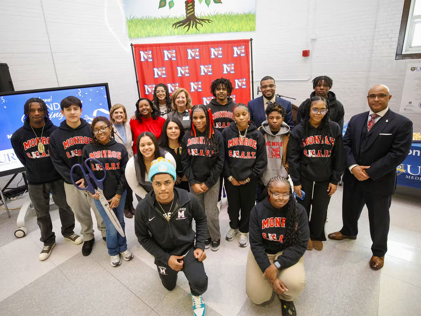 Monroe High School students with School of Nursing and RCSD leadership at the opening of its new Health Center.