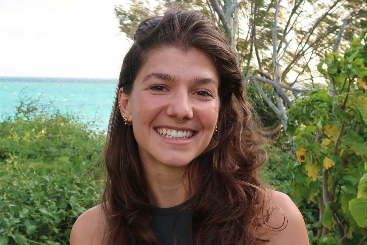 Marceline Martynek seen smiling in front of water and trees