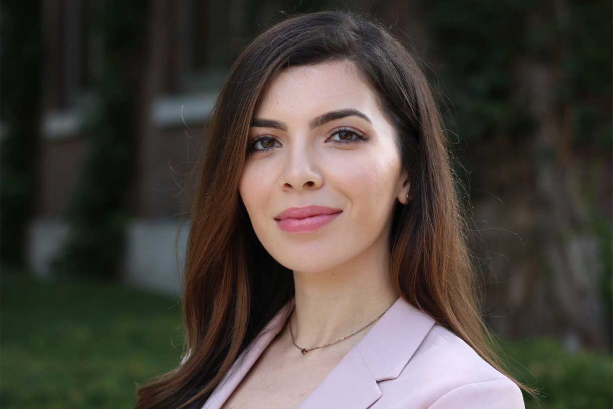 Sultani Hawa seen smiling, wearing pink blazer