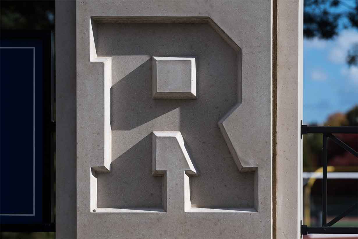 UR letter "R" carved into a block