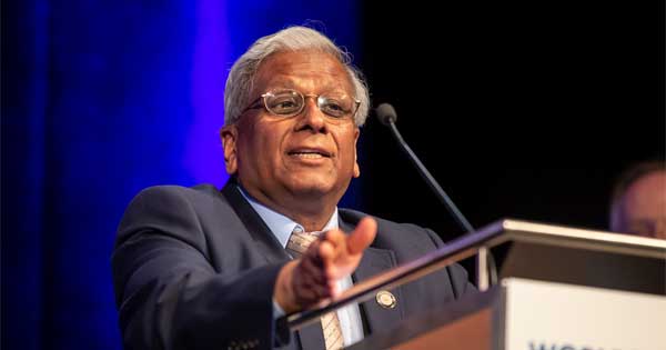 Govind P. Agrawal seen speaking at a podium