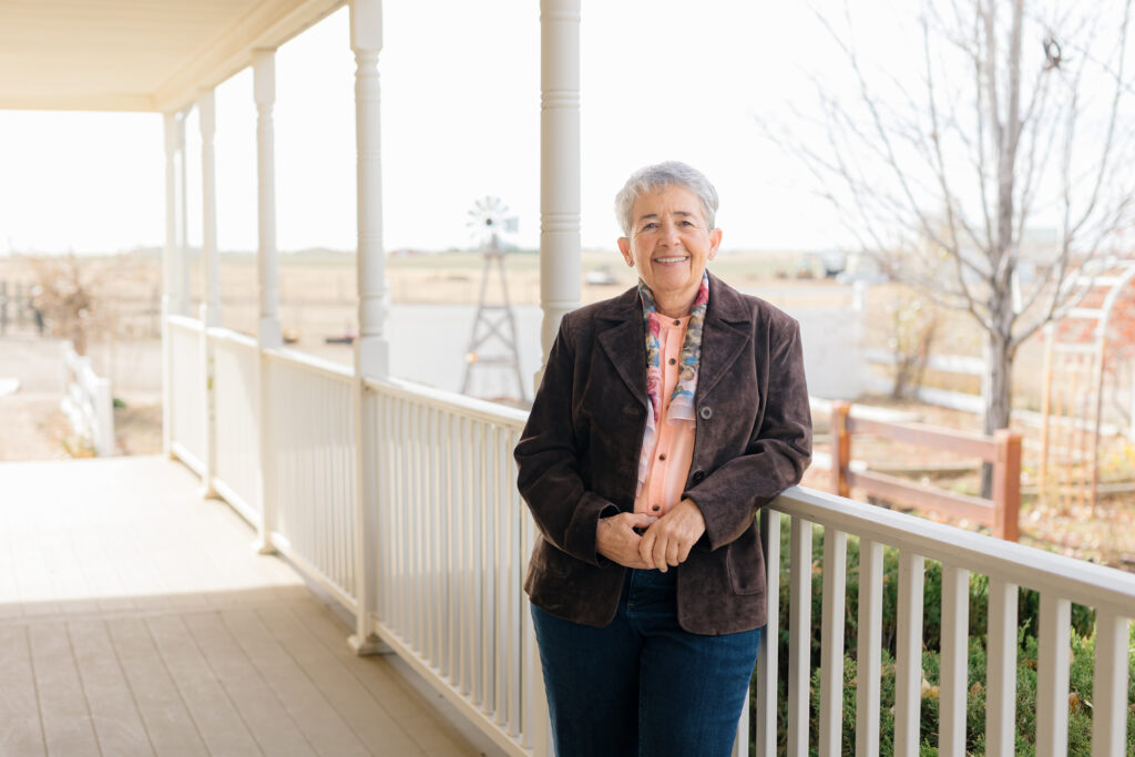 Susan Flow standing on a deck
