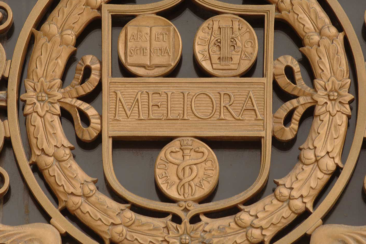 University of Rochester seal in bronze, with the word "Meliora" prominently displayed in the center