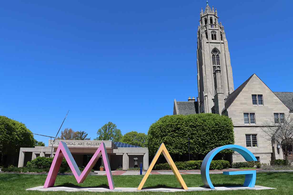 Exterior of Memorial Art Gallery building with MAG letters in front on the lawn