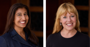 Radhika and Laura standing in front of a brown background