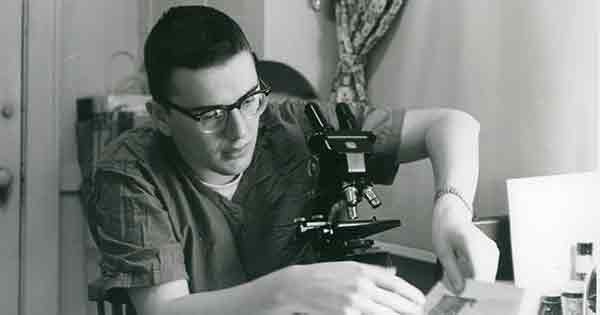 A young Alexander “Al” A. Levitan black and white photo wearing glasses