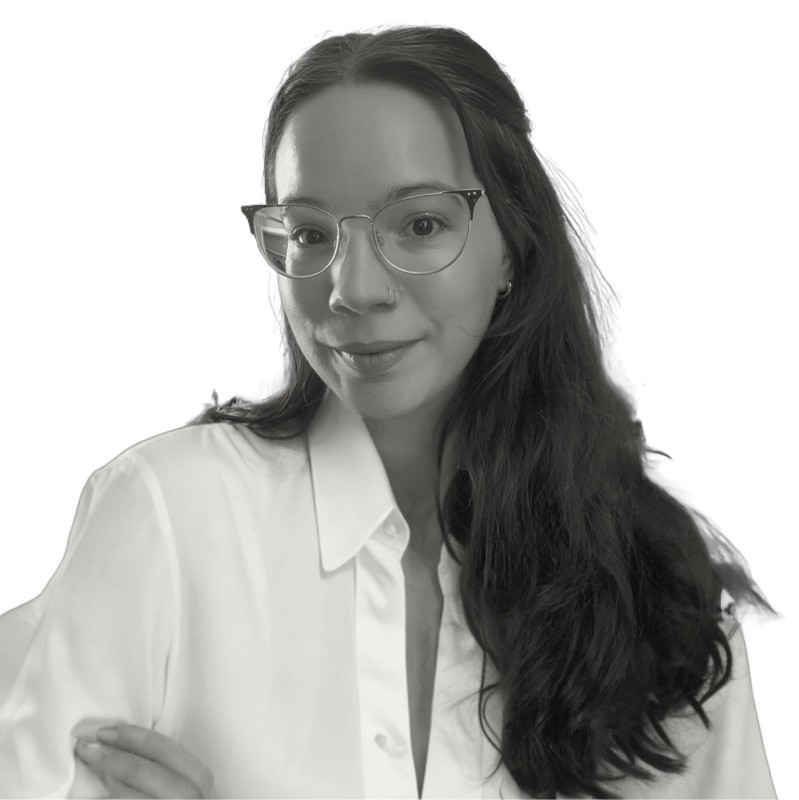 Alisa Jimenez wearing glasses and white blouse